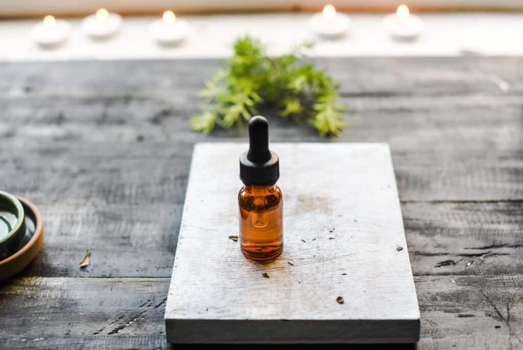 how to make essential oils, brown bottle of essential oil